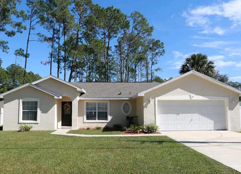 front view of a house with a yard
