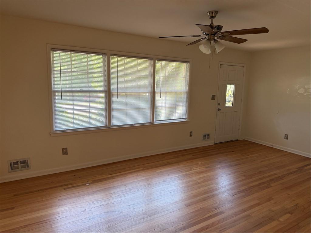 3460 Boring Road Decatur, GA 30034 - Photo 4 of 16 a view of an empty room with wooden floor and a window