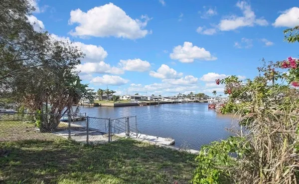 a view of a lake with a yard