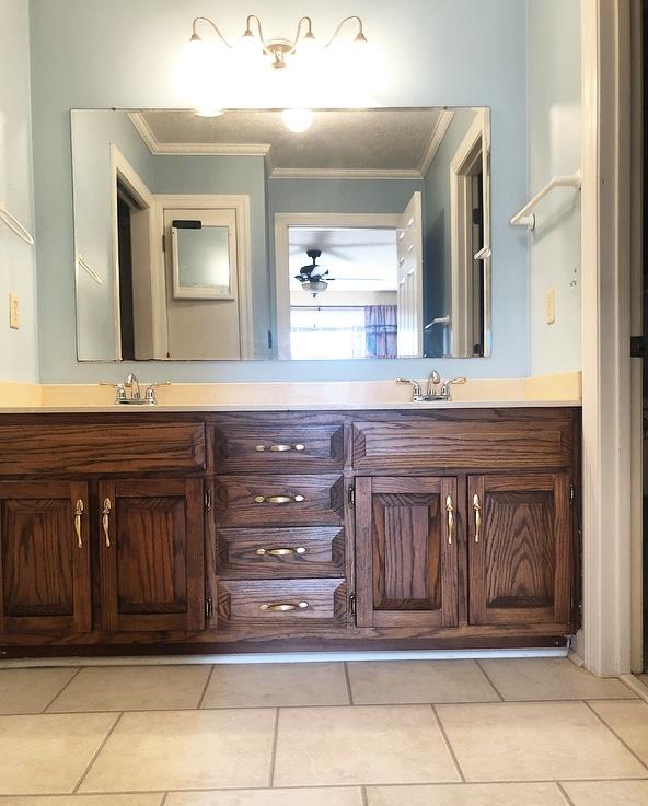1607 Cairo Road Gallatin, TN 37066 - Photo 21 of 30 a bathroom with a sink a vanity and a mirror
