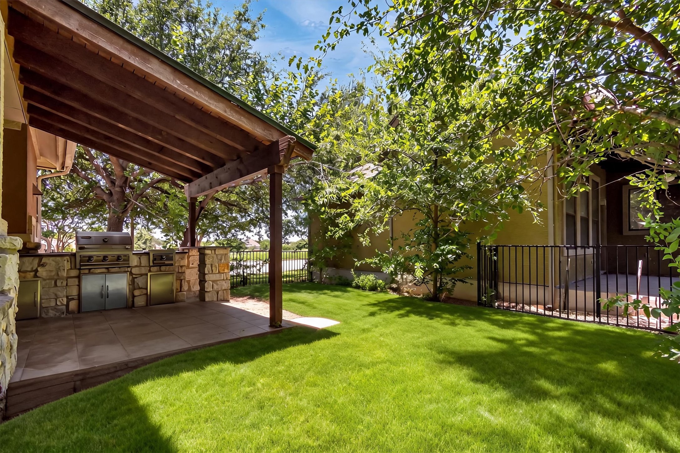 1010 Immanuel Road, Unit 103 Pflugerville, TX 78660 - Photo 30 of 30 An inviting outdoor kitchen area with a built-in grill offers an ideal setting for al fresco dining and entertaining.