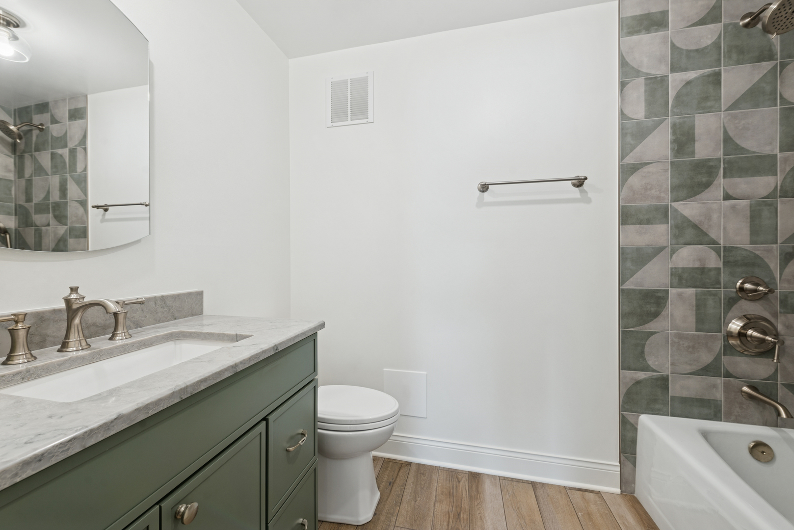 1500 Sheridan Road, Unit 1K Wilmette, IL 60091 - Photo 16 of 25 a bathroom with a granite countertop sink toilet and shower