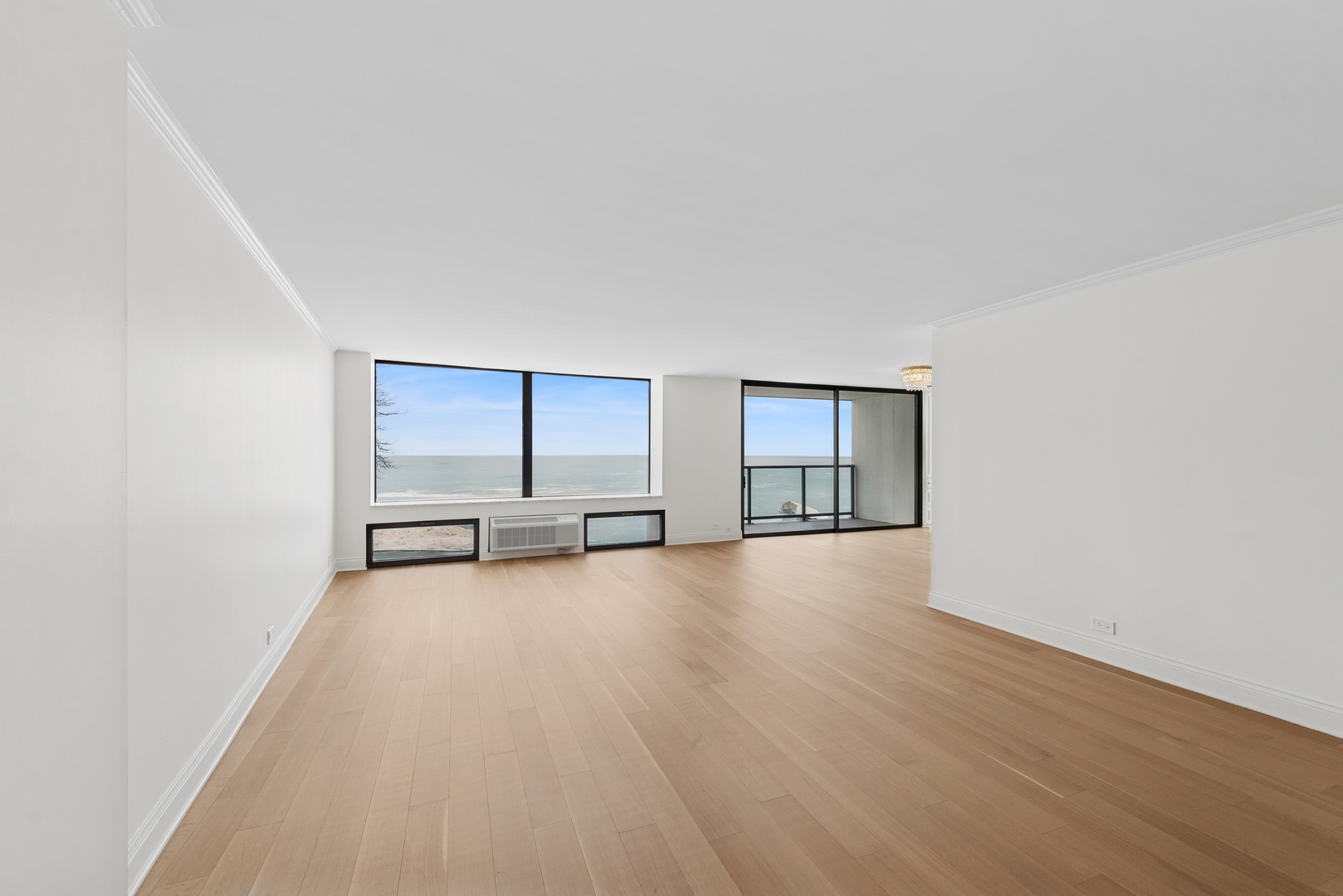 1500 Sheridan Road, Unit 1K Wilmette, IL 60091 - Photo 8 of 25 an empty room with wooden floor and window