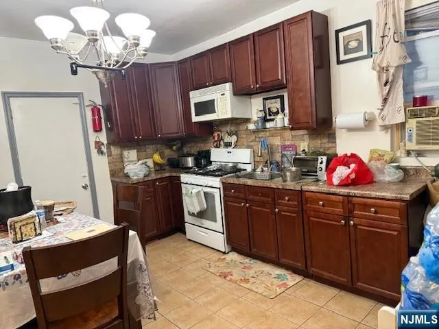 a kitchen with a sink cabinets and window