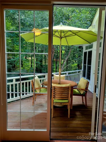 a view of a two chairs in the balcony