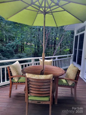 a view of a outdoor sitting area with furniture and wooden deck