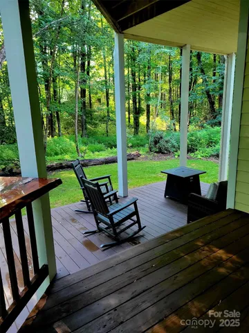 a view of a sitting area with chairs and wooden floor