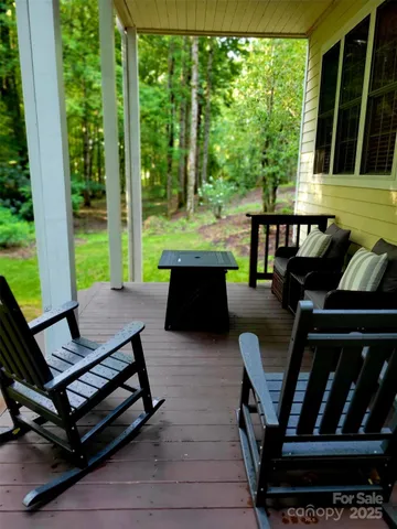 a view of a patio with couple of chairs