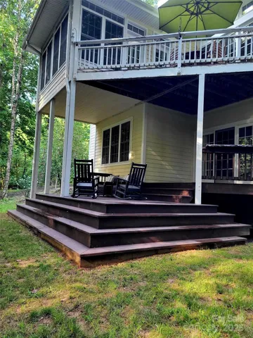 a front view of a house with a swimming pool