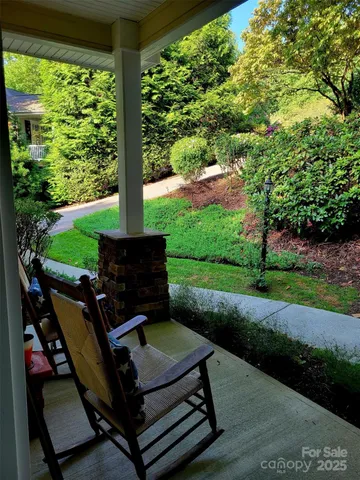 a view of a yard with furniture