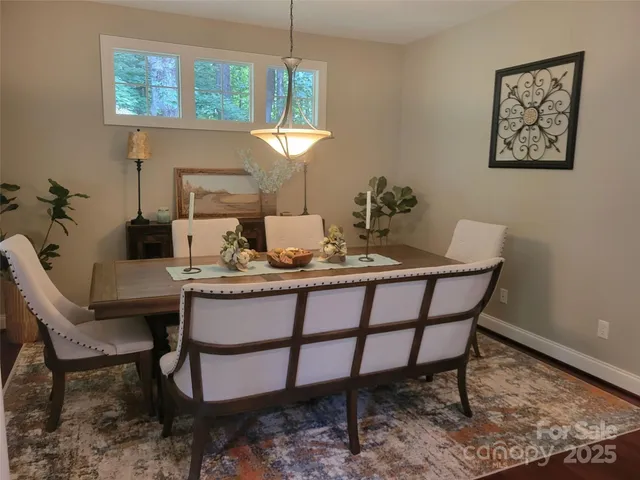 a dining room with furniture and window