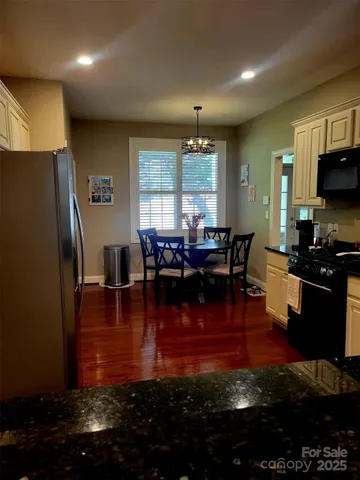 a living room with fireplace furniture and a flat screen tv