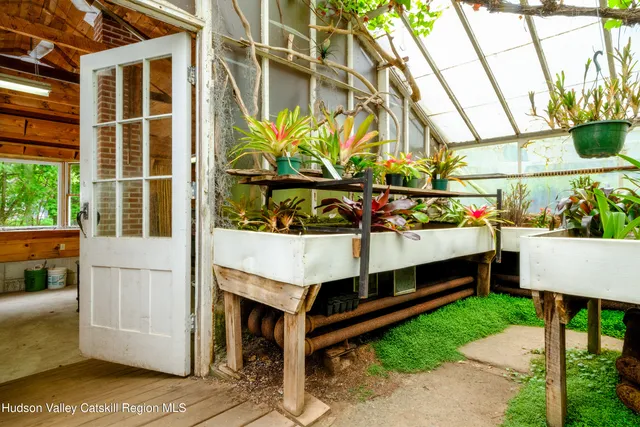 a kitchen with a sink window and cabinets
