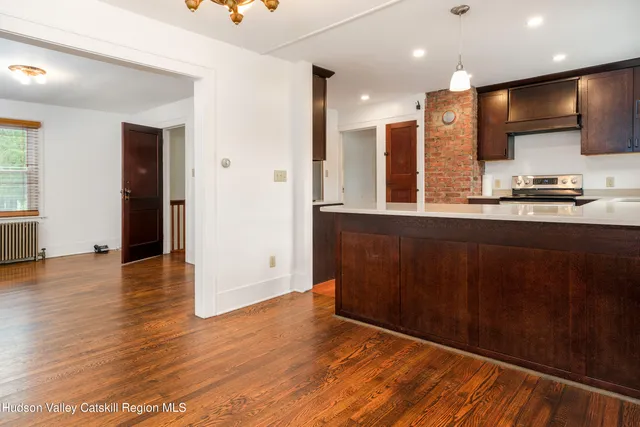 a view of a wooden house with a yard