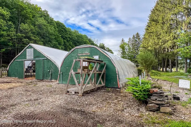 a view of house with backyard