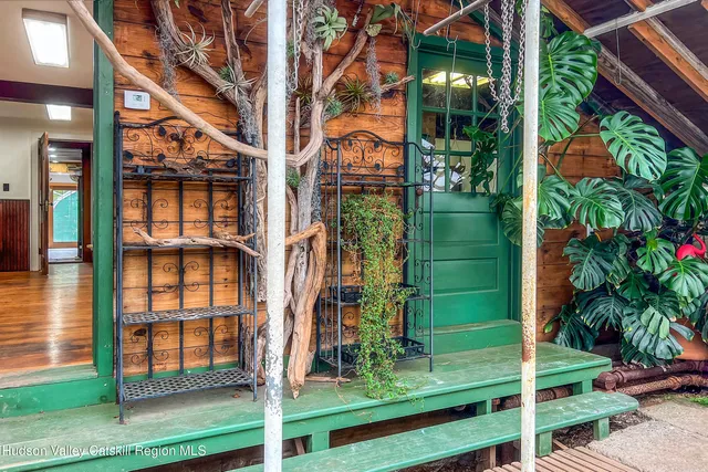 a view of a house with a yard and plants