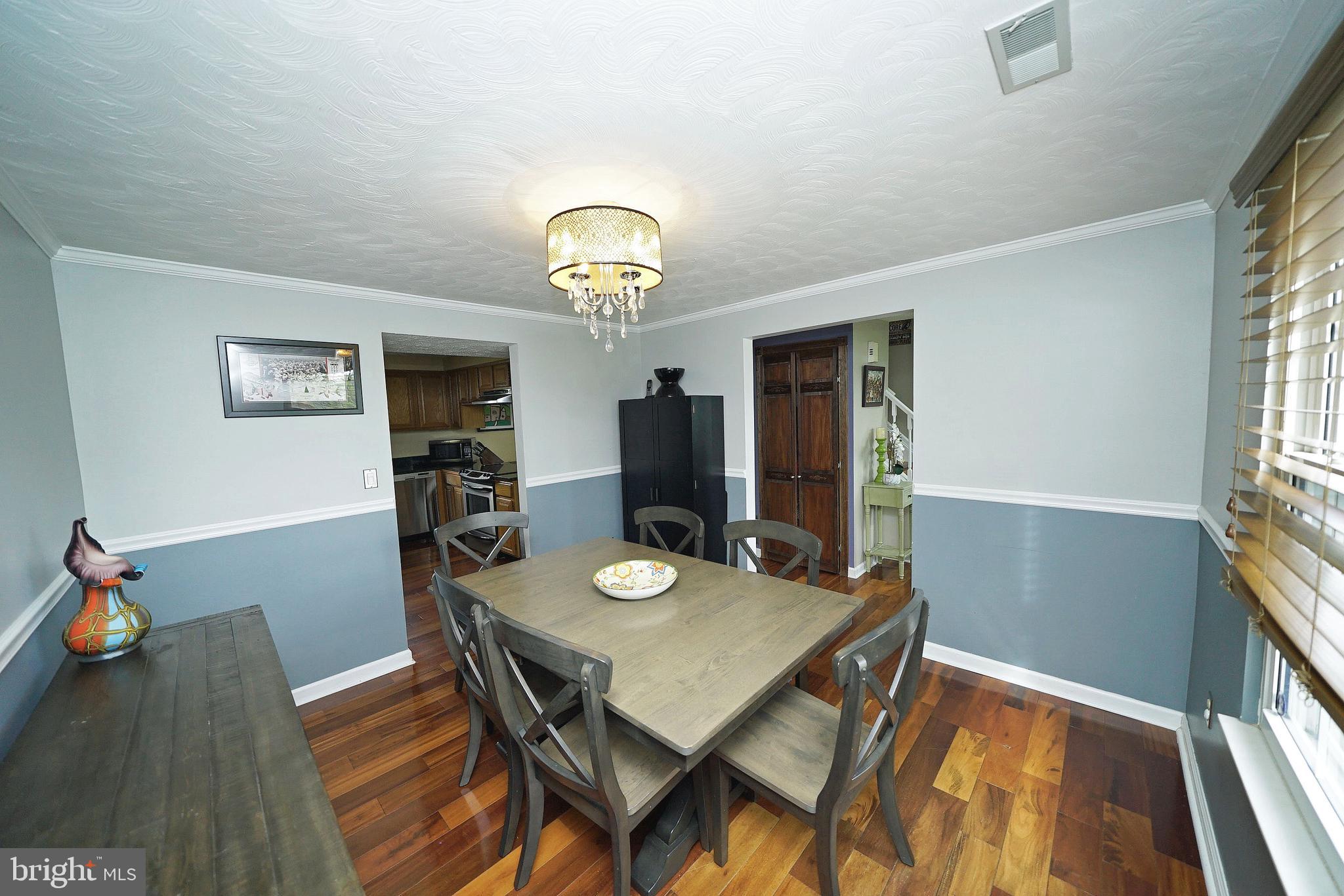 4424 Cub Run Road Chantilly, VA 20151 - Photo 17 of 30 a view of a dining room with furniture and wooden floor