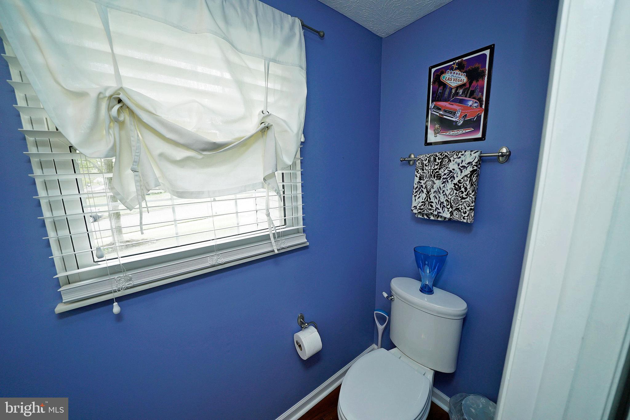 4424 Cub Run Road Chantilly, VA 20151 - Photo 20 of 30 a bathroom with a toilet and a window