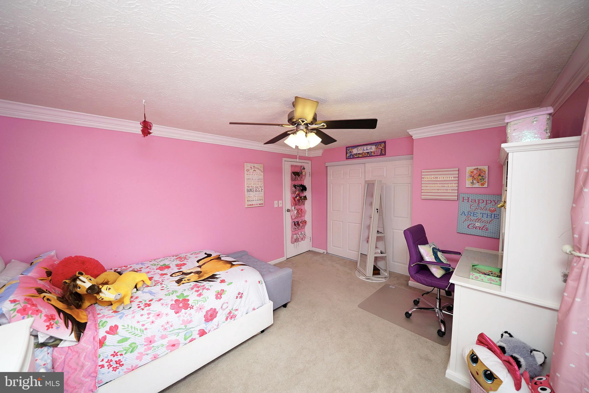 4424 Cub Run Road Chantilly, VA 20151 - Photo 28 of 30 a bedroom with a bed and a chandelier