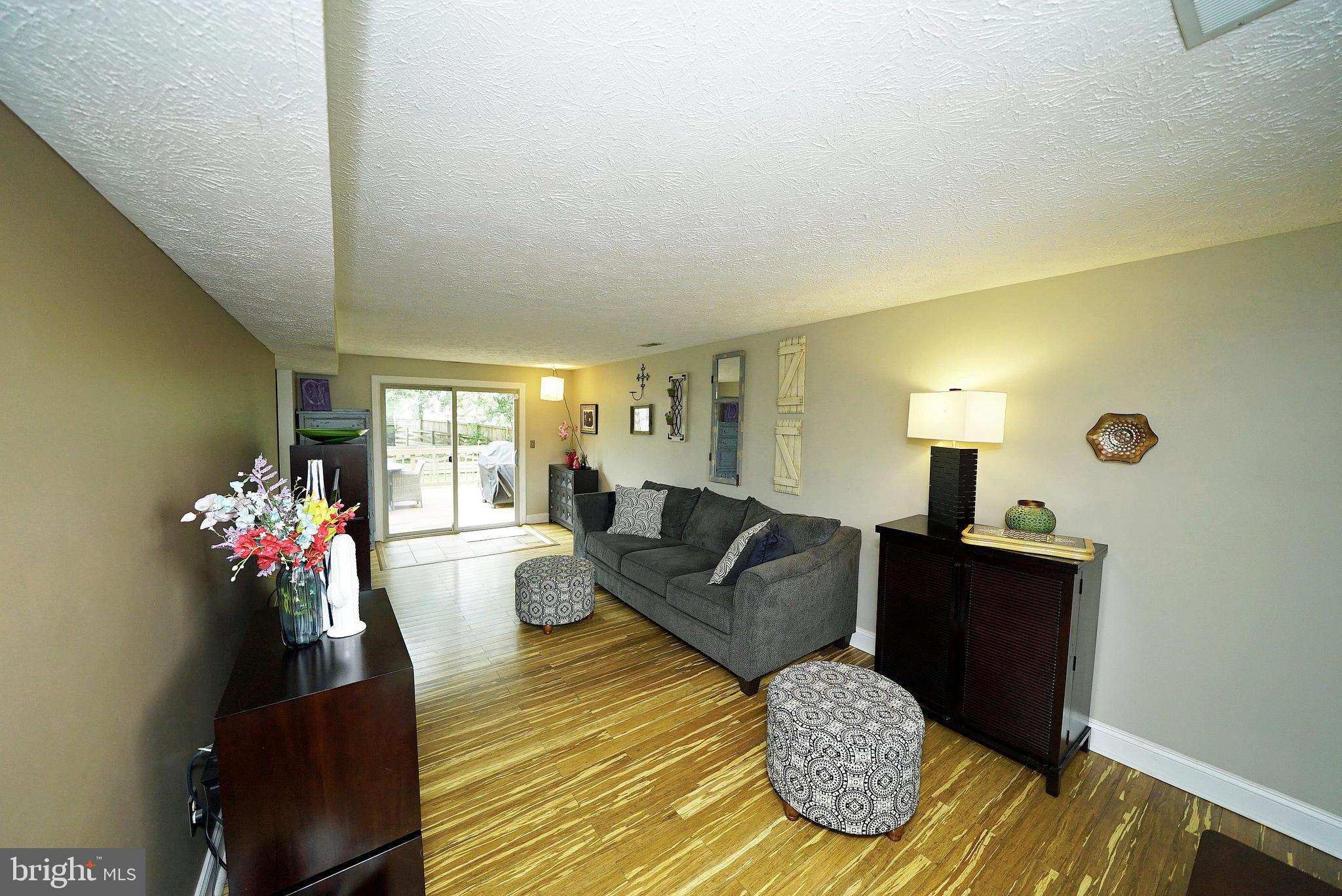 4424 Cub Run Road Chantilly, VA 20151 - Photo 9 of 30 a living room with furniture and flowers
