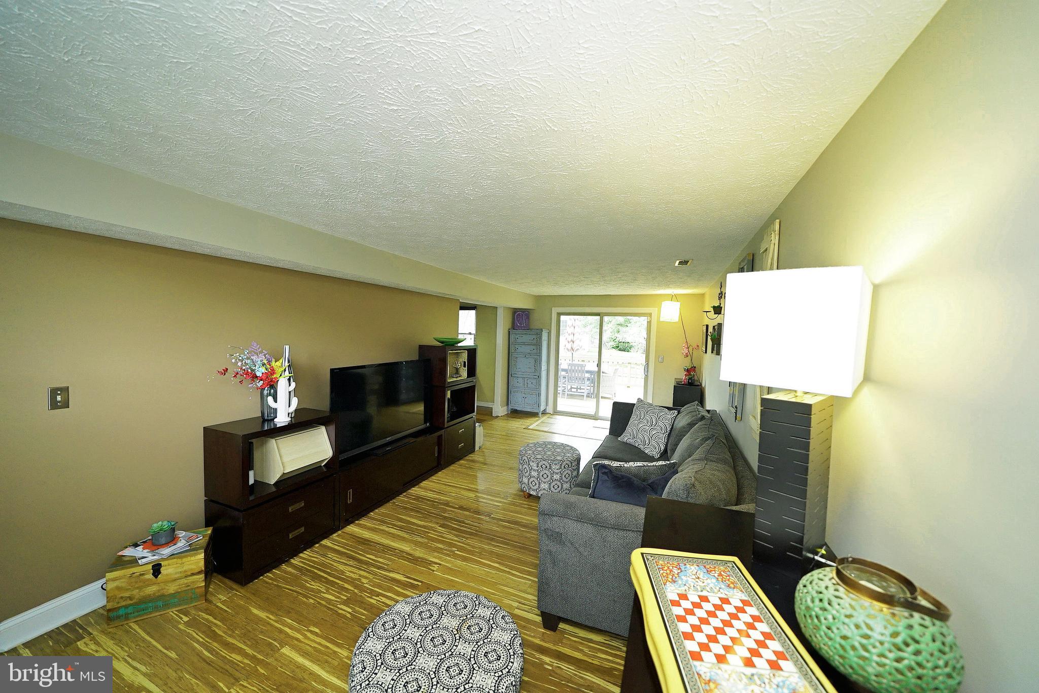 4424 Cub Run Road Chantilly, VA 20151 - Photo 10 of 30 a living room with furniture and a flat screen tv