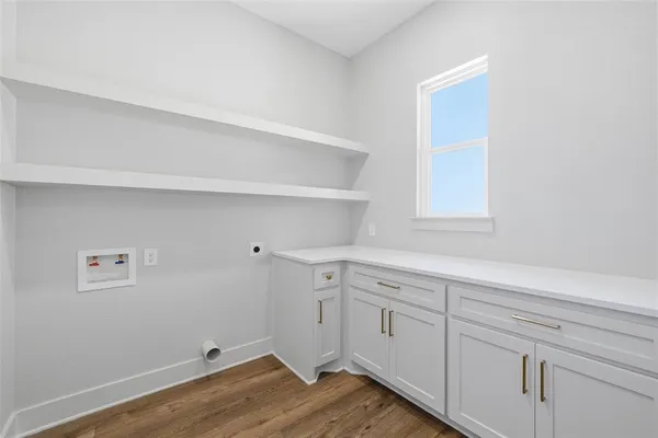 a view of cabinets and wooden floor