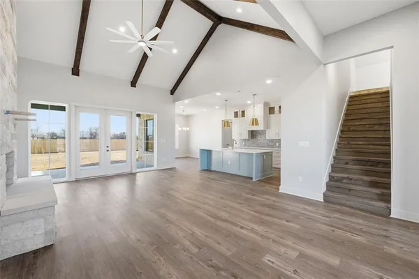 a view of kitchen and hall with wooden floor