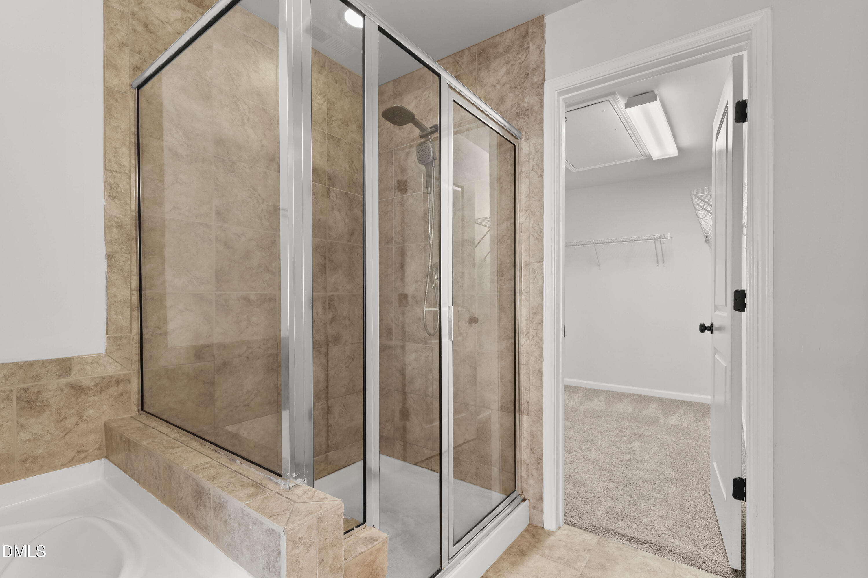 1109 Laurel Twist Road Cary, NC 27513 - Photo 24 of 37 a bathroom with a glass shower door