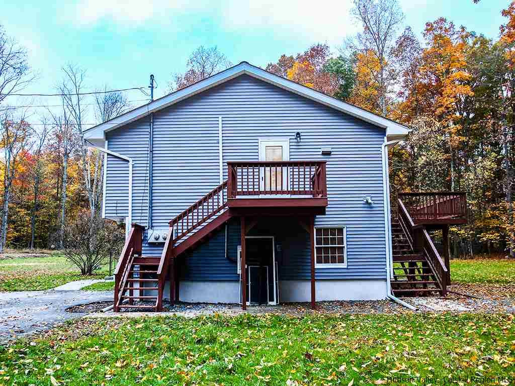 589 Decker Road Wallkill, NY 12589 - Photo 3 of 26 a front view of a house with garden