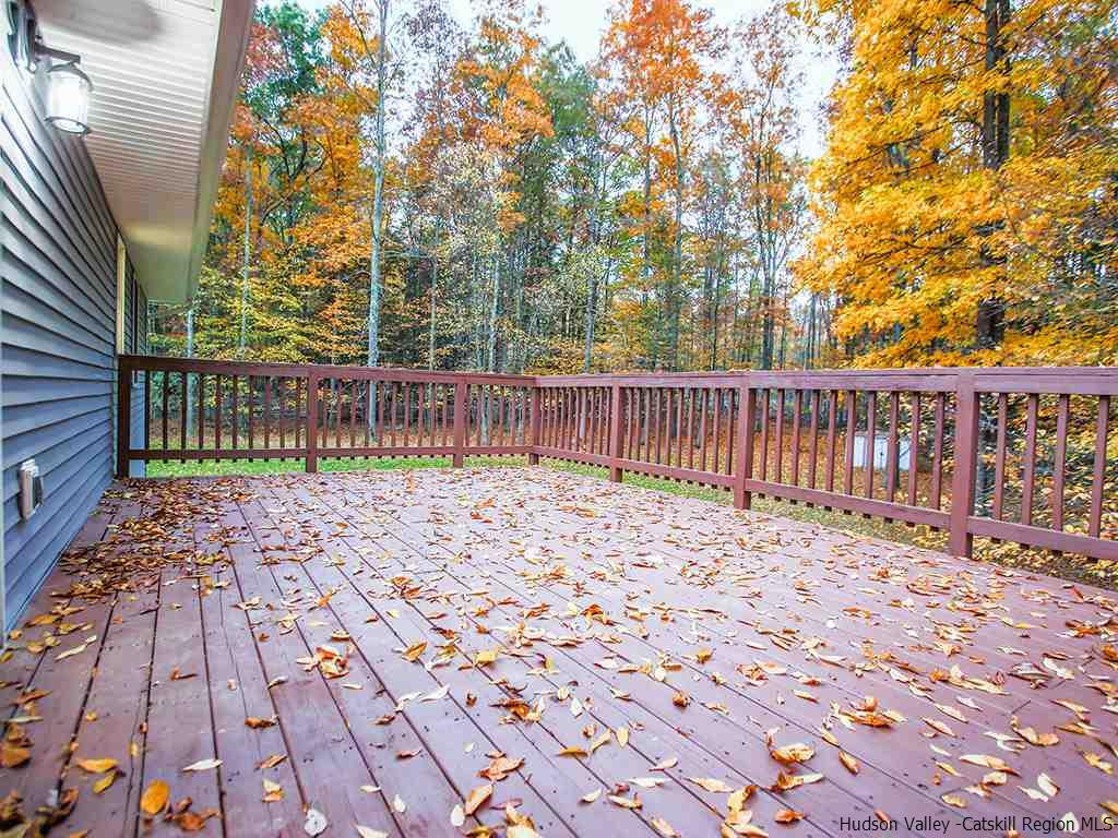 589 Decker Road Wallkill, NY 12589 - Photo 8 of 26 a street view with wooden fence