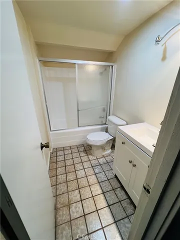 a bathroom with a sink a toilet and a shower