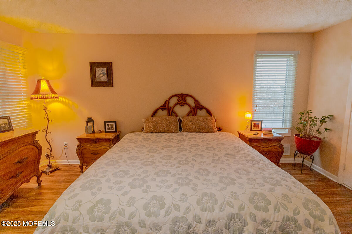 8 Hidden Harbor Drive Point Pleasant, NJ 08742 - Photo 14 of 32 a bedroom with a bed a table and chair