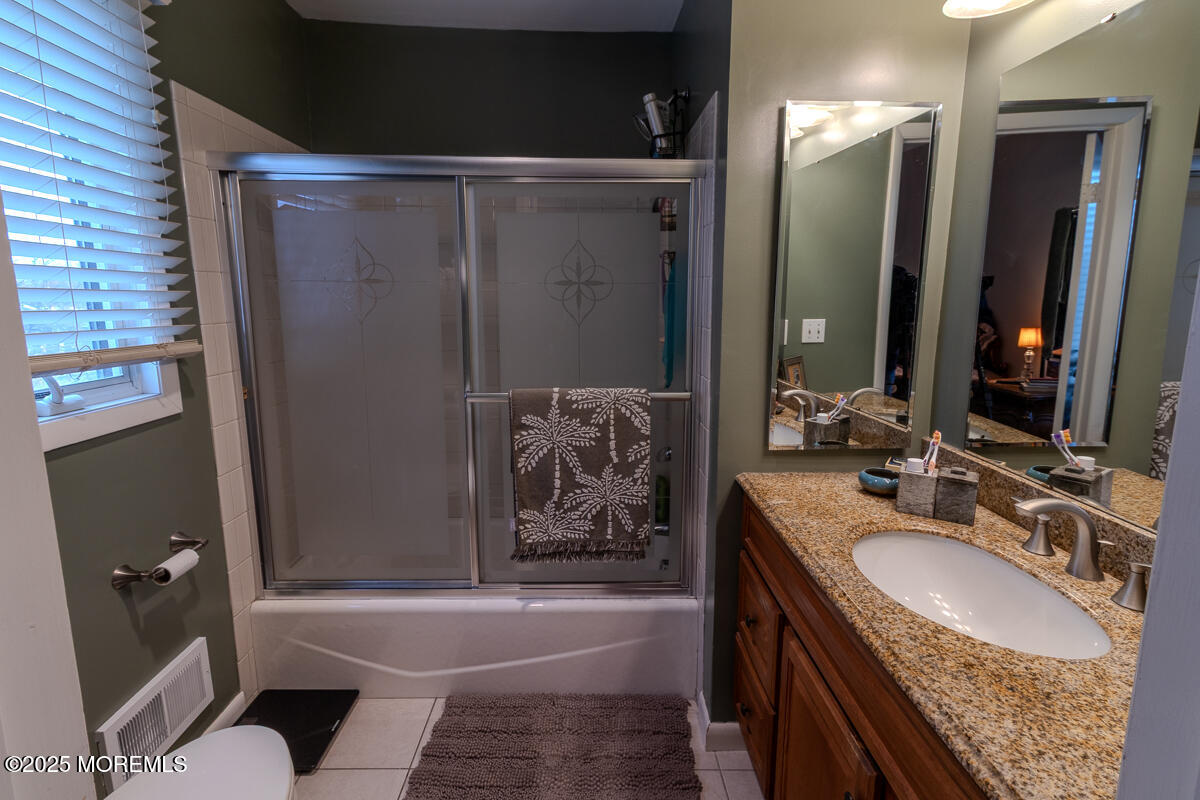 8 Hidden Harbor Drive Point Pleasant, NJ 08742 - Photo 17 of 32 a bathroom with a granite countertop bathtub sink vanity granite and shower