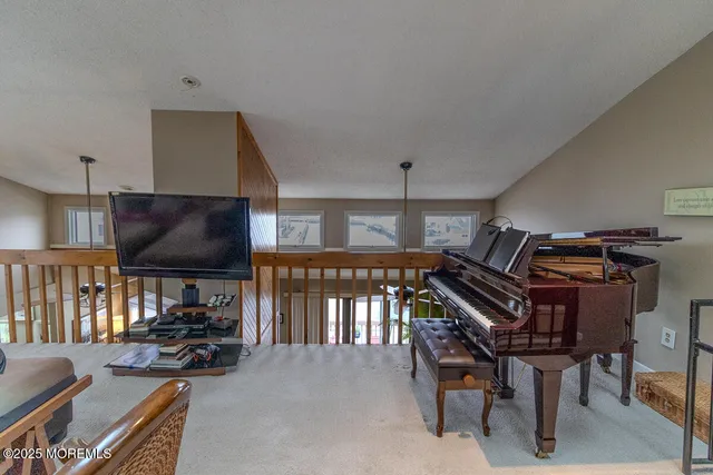 a very nice looking room with wooden floor and windows