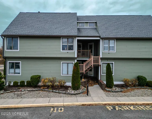 a building with potted plants in front of it