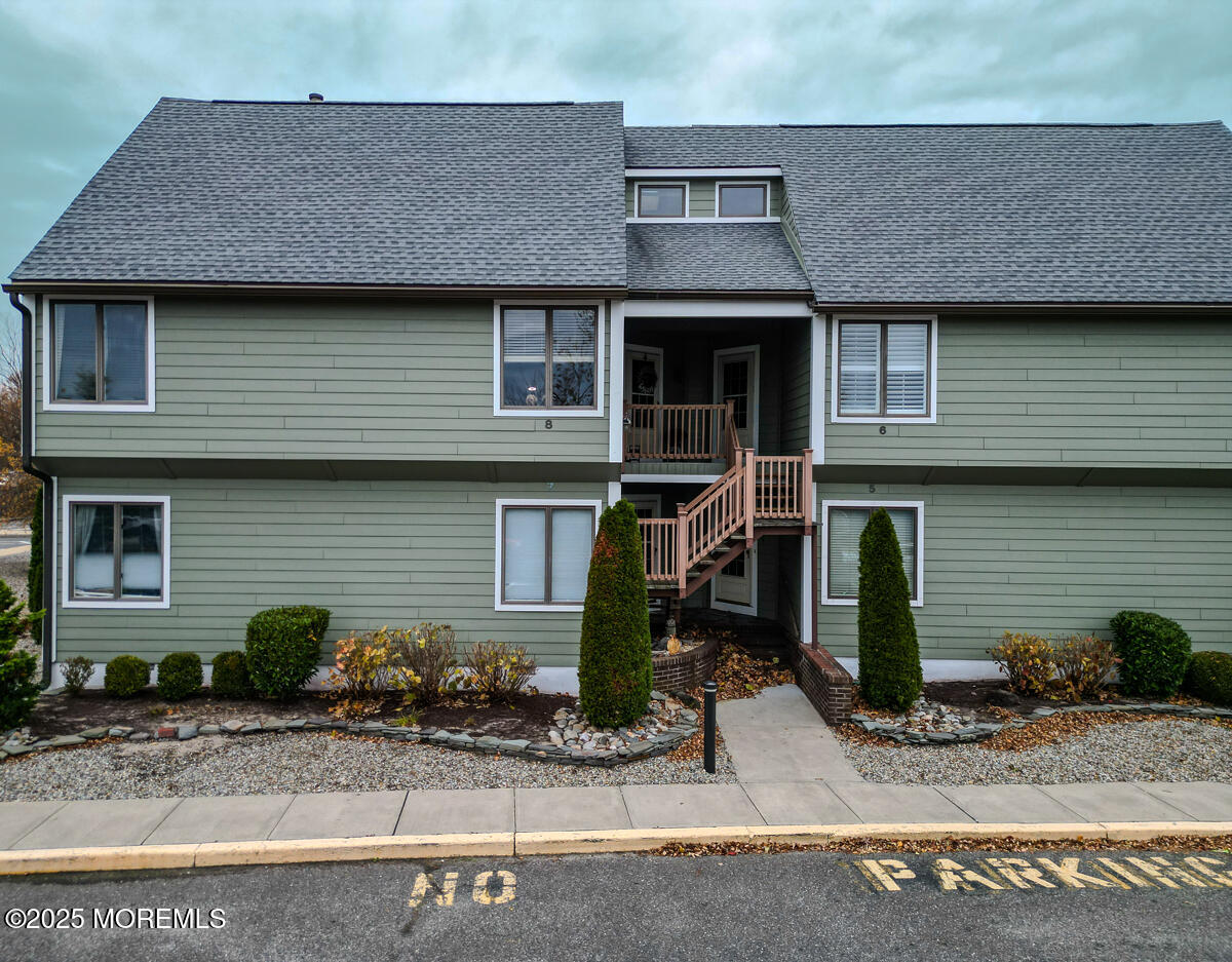8 Hidden Harbor Drive Point Pleasant, NJ 08742 - Photo 3 of 32 a front view of a house with garden