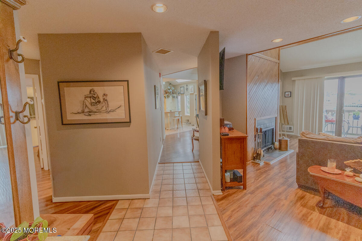 8 Hidden Harbor Drive Point Pleasant, NJ 08742 - Photo 6 of 32 a view of a hallway with wooden floor and furniture