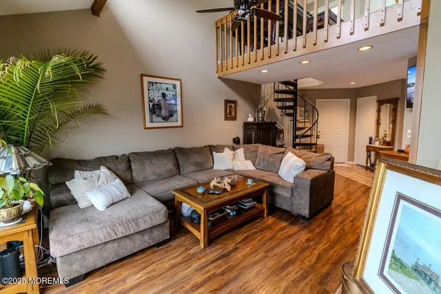 a view of a dining room with furniture and chandelier