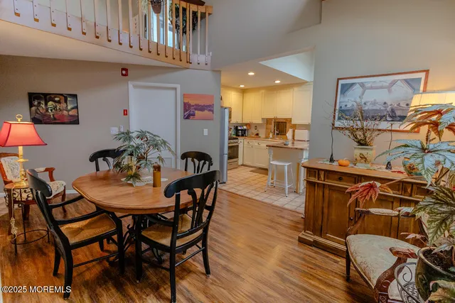 a kitchen with stainless steel appliances kitchen island granite countertop a refrigerator and a stove top oven