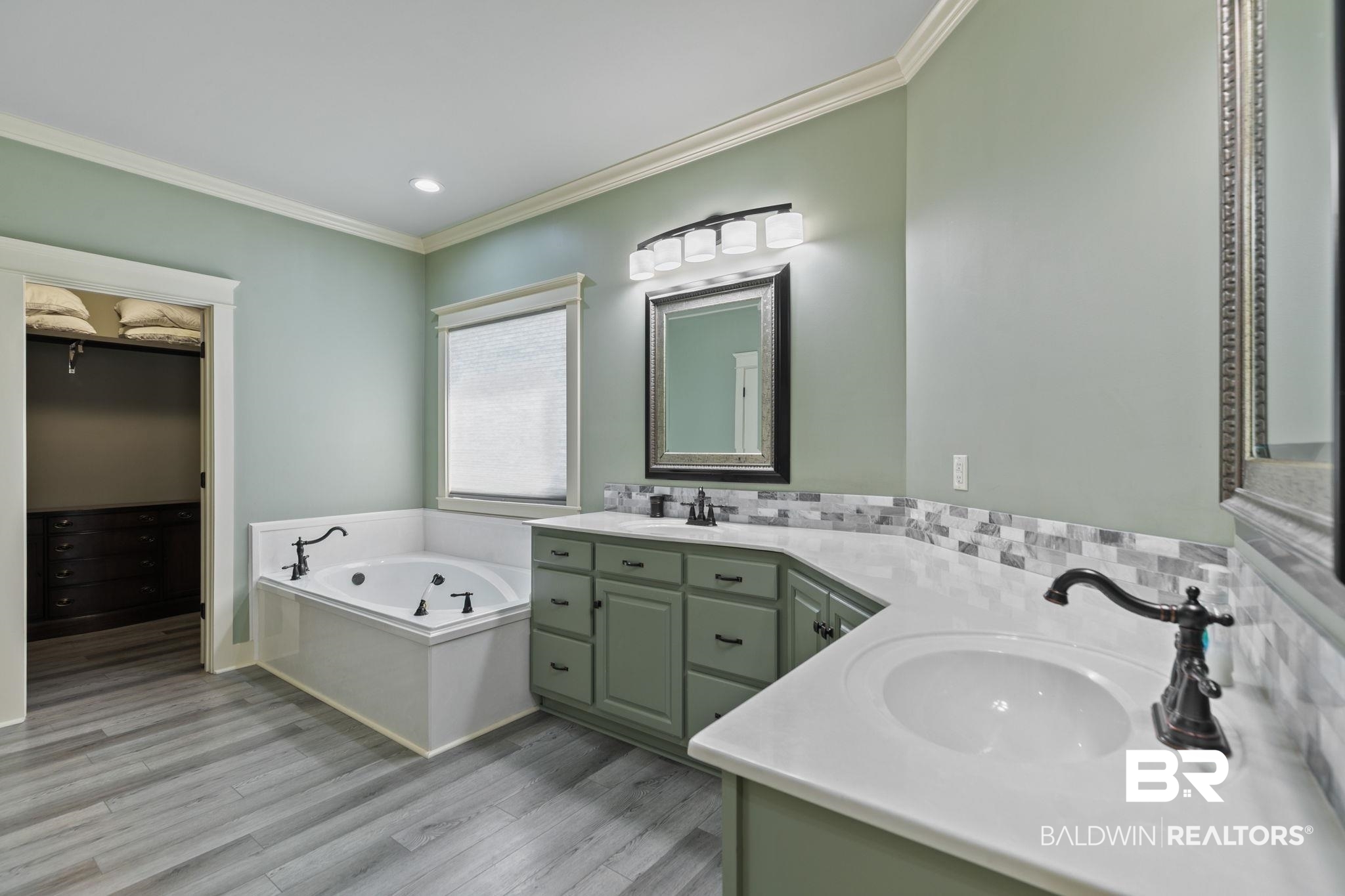 9584 Sanibel Loop Daphne, AL 36526 - Photo 22 of 48 Full bath with double vanity, ornamental molding, a garden tub, light wood-type flooring, and recessed lighting