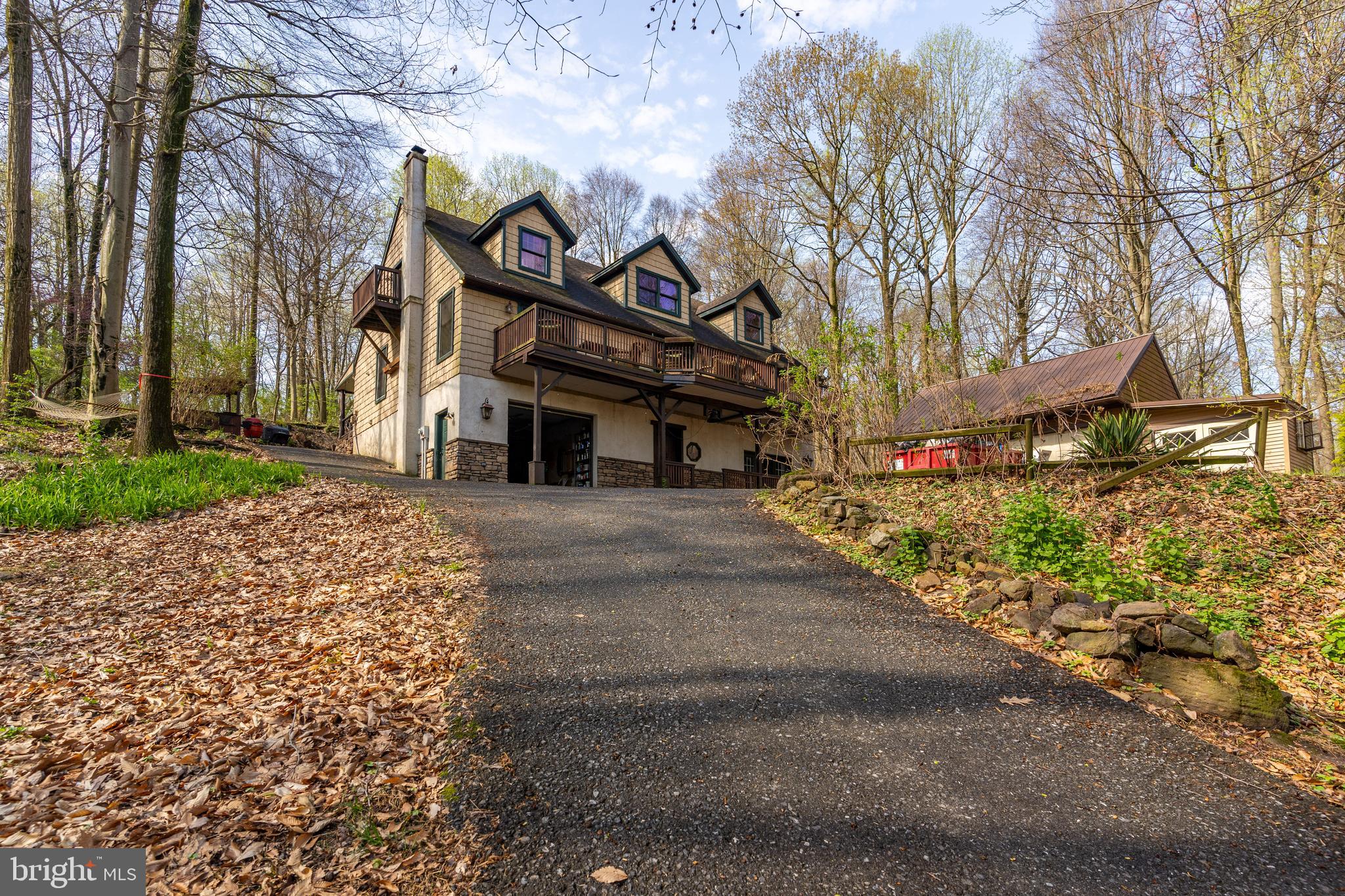 a front view of a building with trees