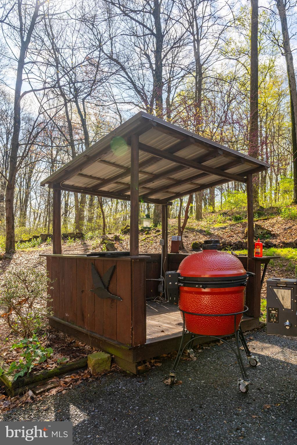 755 Sportsman Road Denver, PA 17517 - Photo 17 of 77 a backyard of a house with barbeque oven table and chairs