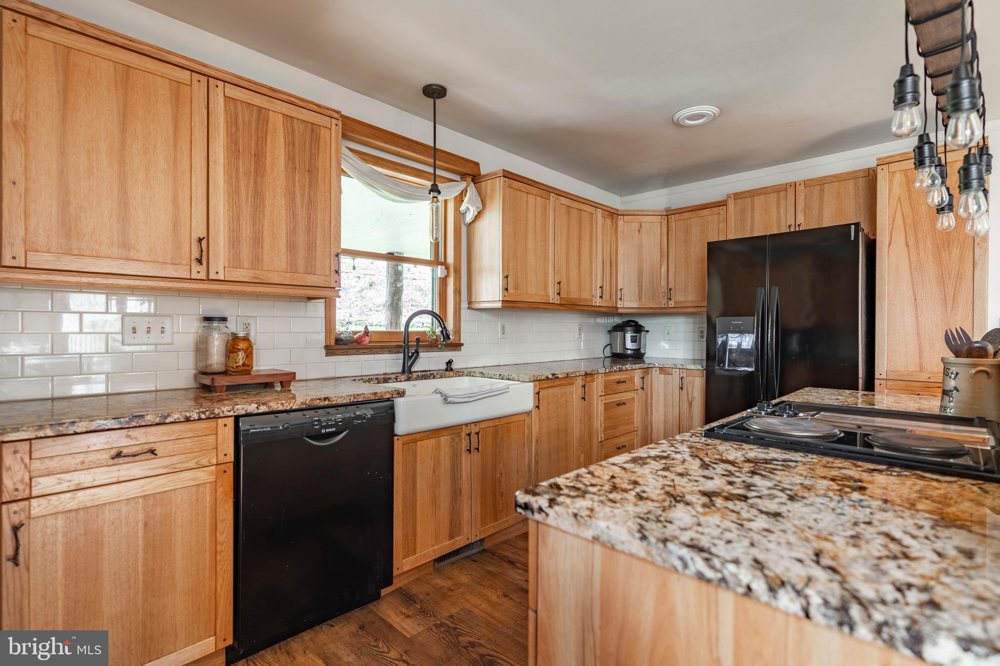 755 Sportsman Road Denver, PA 17517 - Photo 44 of 77 a kitchen with stainless steel appliances granite countertop a stove a sink dishwasher and a refrigerator