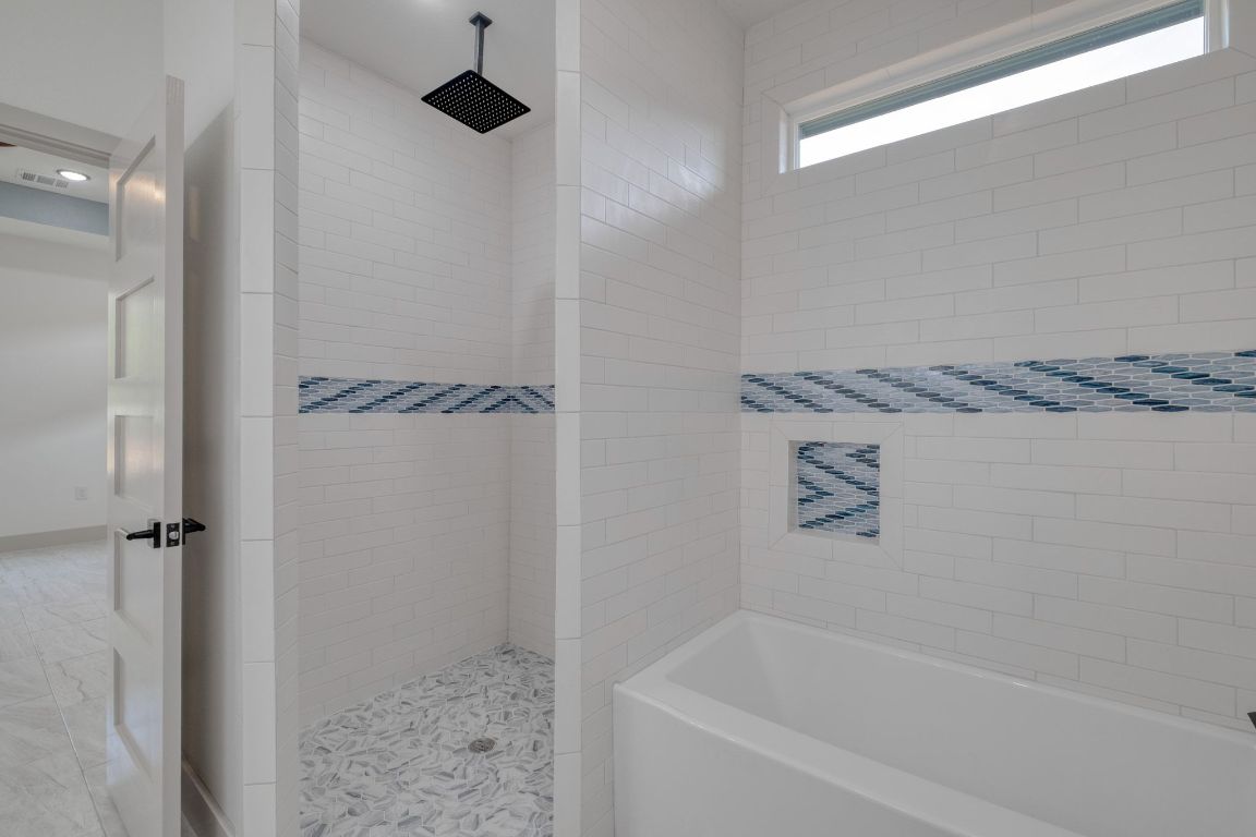 202 Washington Street Elgin, TX 78621 - Photo 16 of 26 View of full Primary bath with free standing tub and shower
