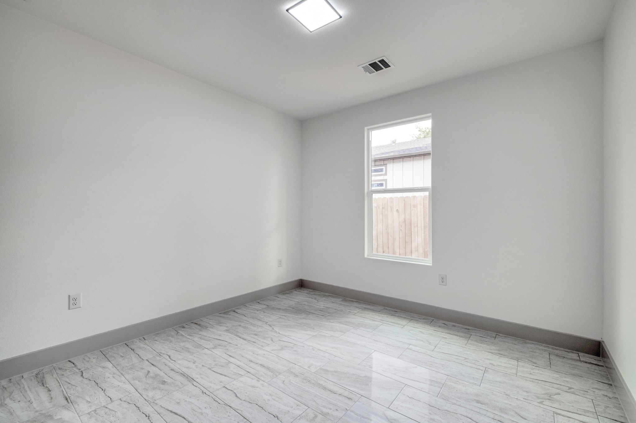 202 Washington Street Elgin, TX 78621 - Photo 20 of 26 Empty room featuring baseboards