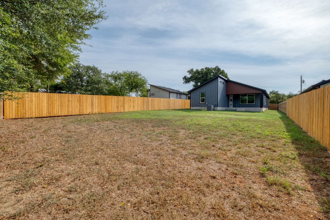 202 Washington Street Elgin, TX 78621 - Photo 26 of 26 Fenced backyard featuring a patio