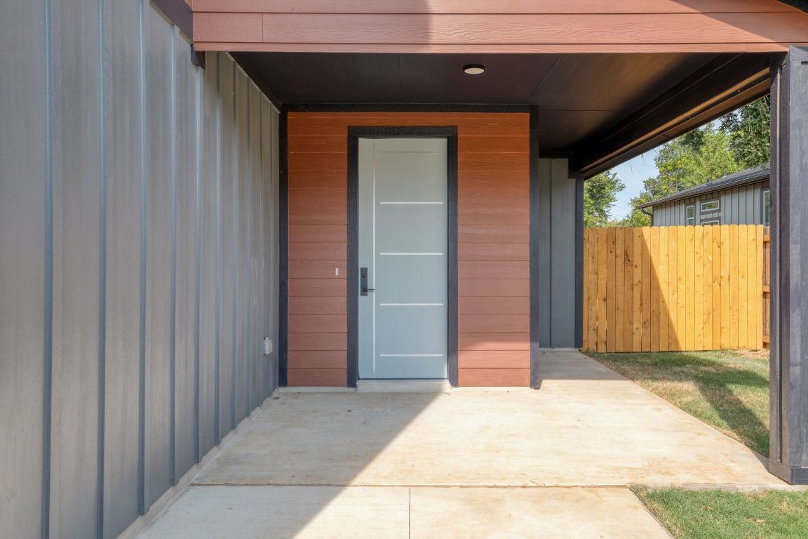 202 Washington Street Elgin, TX 78621 - Photo 4 of 26 Doorway to property with a patio
