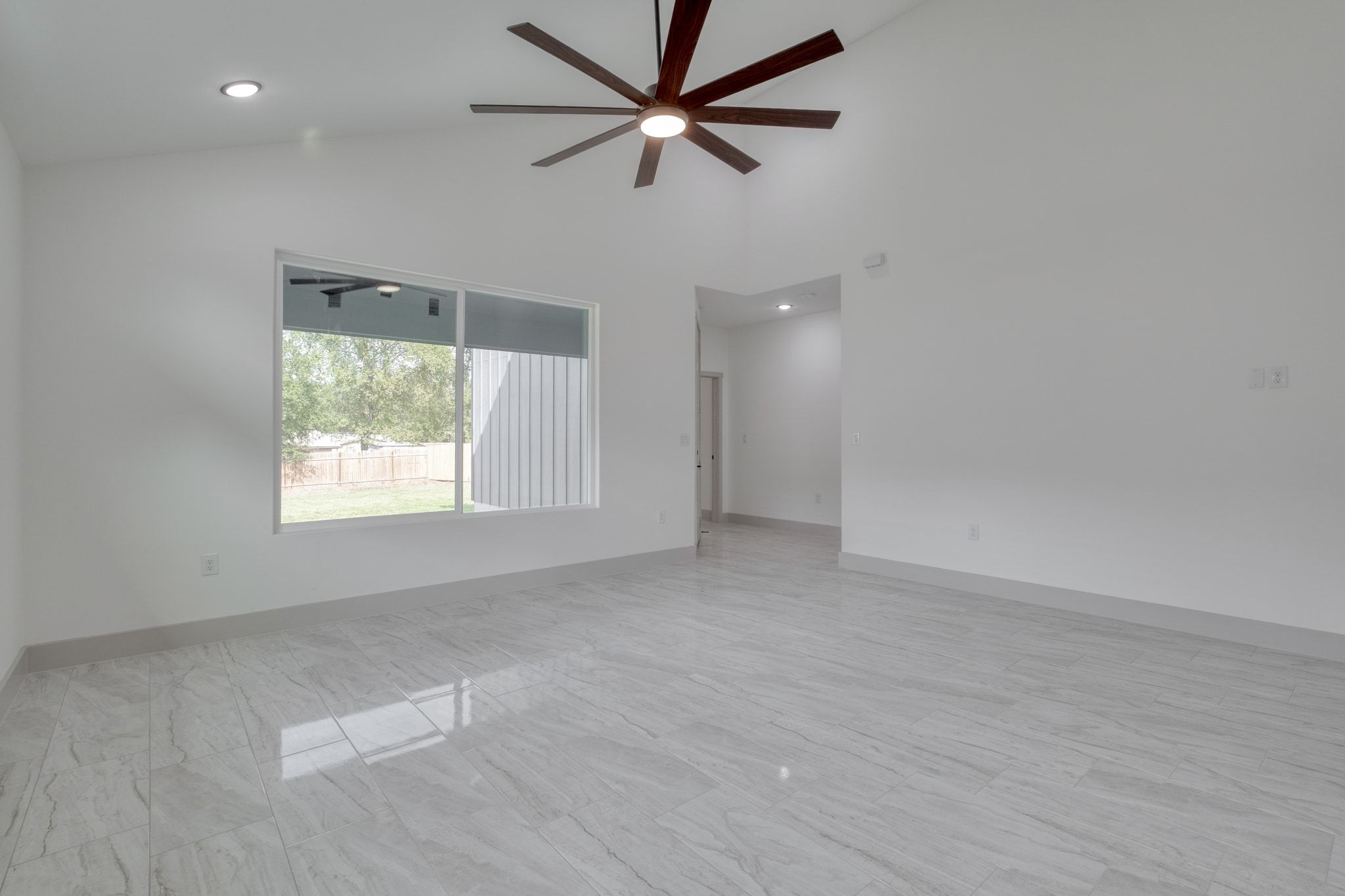 202 Washington Street Elgin, TX 78621 - Photo 10 of 26 Spare room featuring high vaulted ceiling, recessed lighting, and ceiling fan