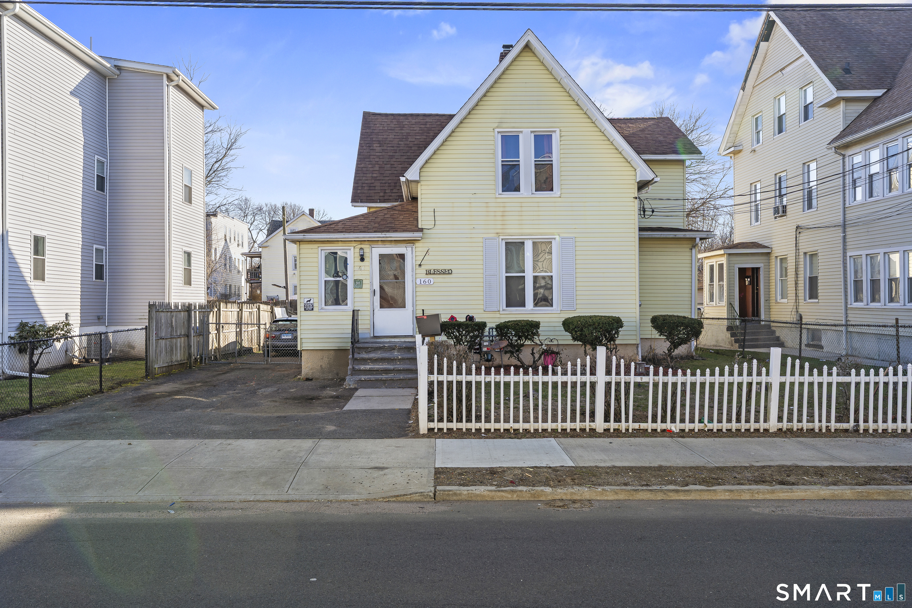160 Springdale Avenue Meriden, CT 06451 - Photo 1 of 19 a view of a white house with iron fence