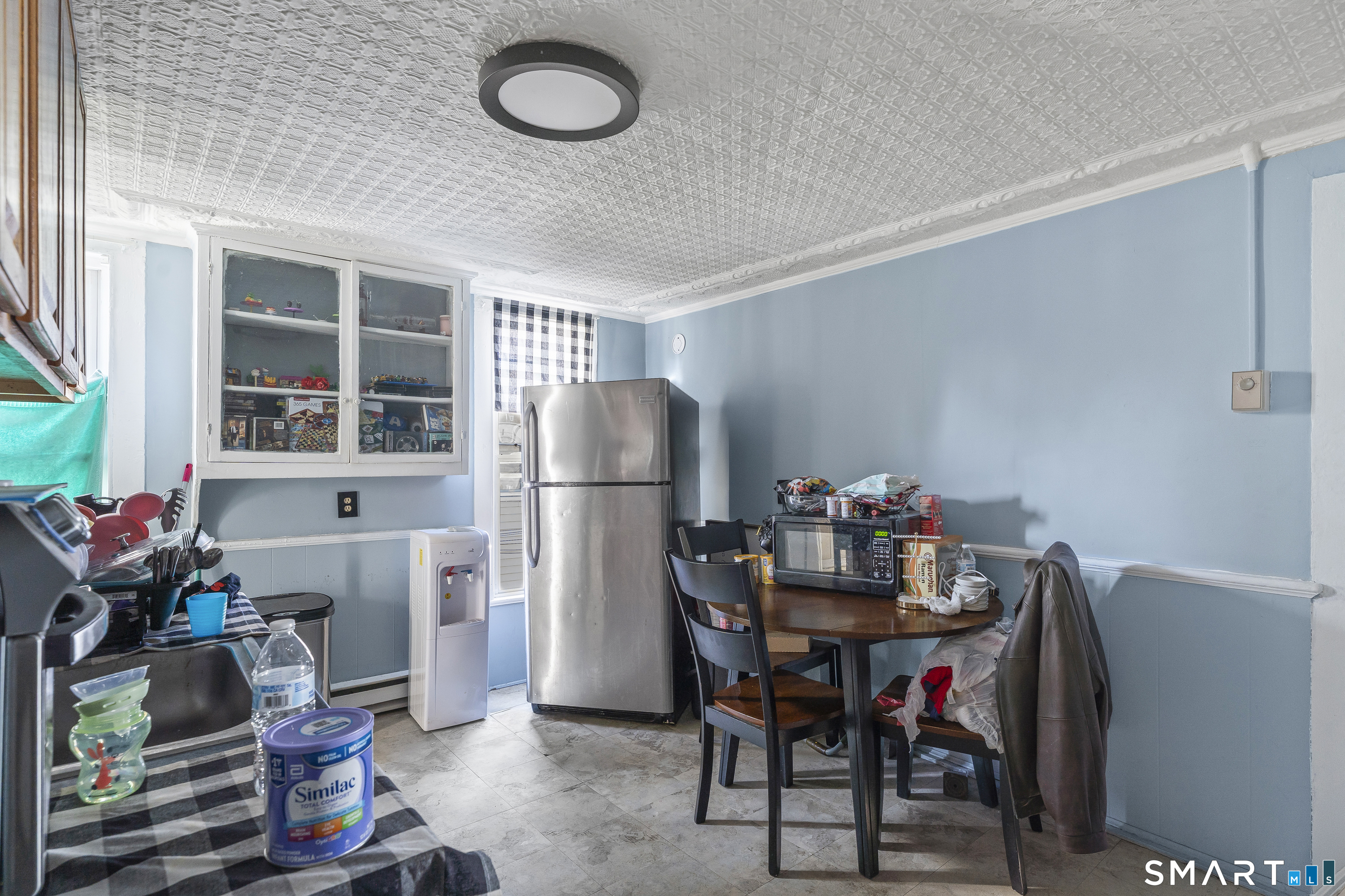 160 Springdale Avenue Meriden, CT 06451 - Photo 14 of 19 a view of a dining room with furniture and a potted plant
